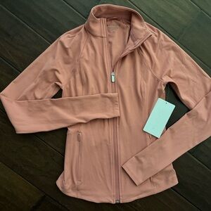 Athleta Salutation zip-up jacket in salmon or coral color. Size XXS. NWT.